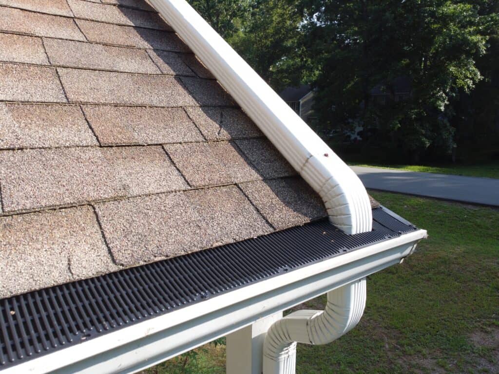 Gutter Guards Installed with Downspout from second story